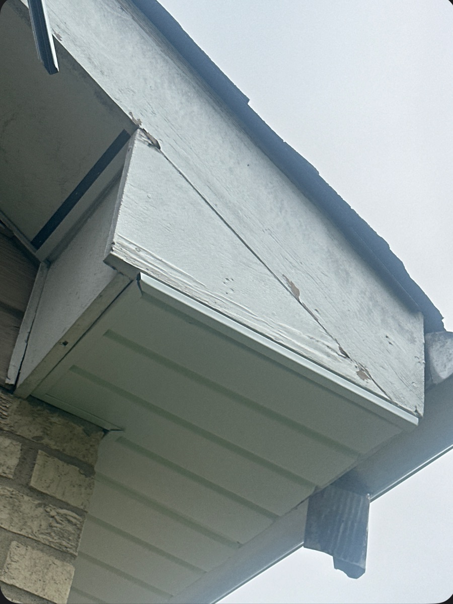 Old weathered, peeling wood fascia and soffit before GRA replaced it