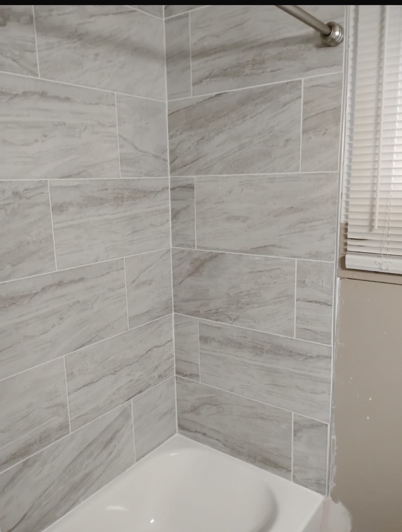 New marble-look tile tub and shower surround remodeled by GRA