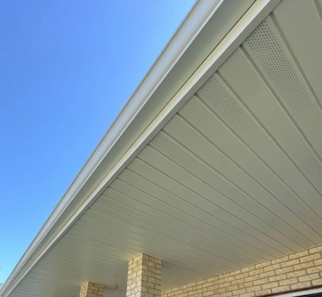 Freshly installed aluminum soffit and fascia on a brick home in the south suburbs